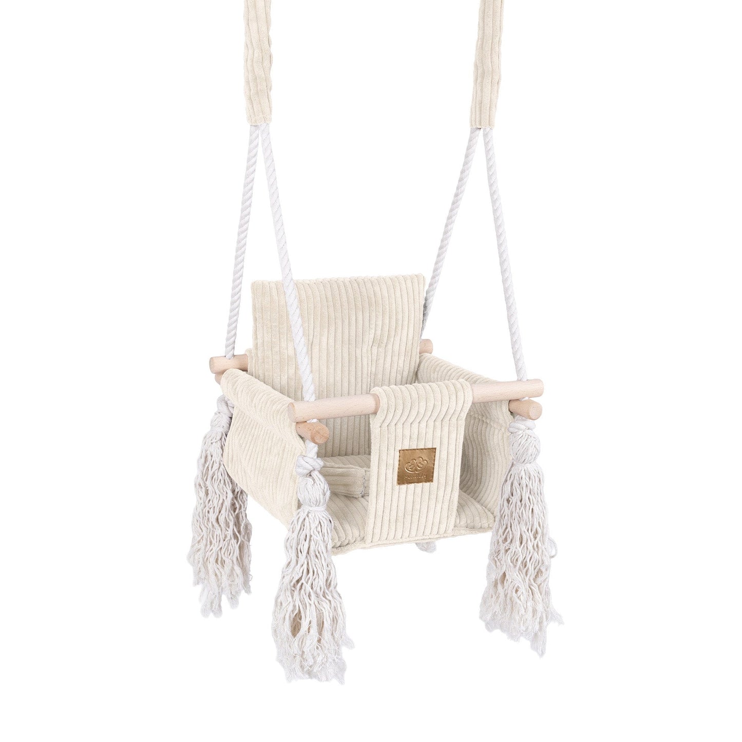 Children's swing with white ropes and fringes
